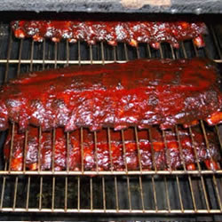 a few slabs of ribs on the smoker