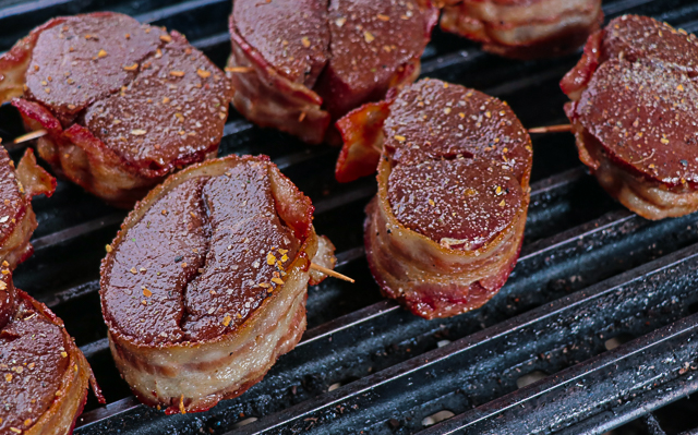 bacon wrapped deer filets on the grill