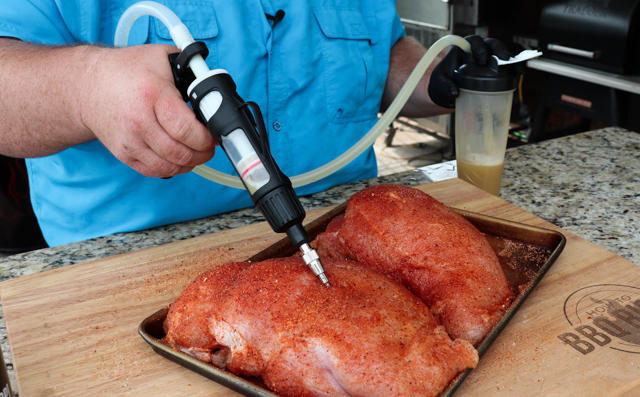 Injecting Honey Smoked Turkey Breast