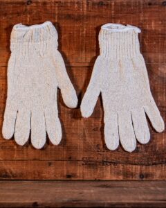 White, cotton gloves worn under latex gloves for handling hot foods and working on hot smokers and grills